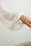 Sleeve detail on silk blouse